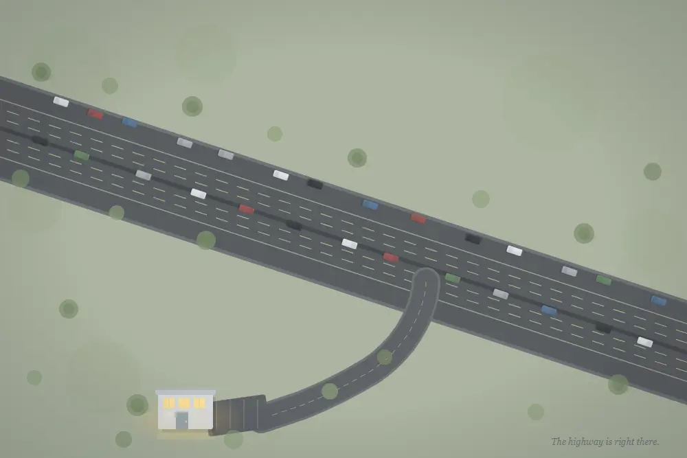 why is my website not getting traffic aerial view of a busy highway with one empty on-ramp leading to a lit building